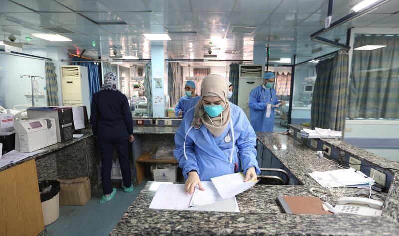 Health personnel prepare quarantine rooms at the government-run Al Mojtahed hospital in Damascus, Syria, on March 19, 2020. EPA