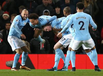 epa06381908 Manchester City's David Silva (L) celebrates scoring with teammates during the English premier league soccer match between Manchester united and Manchester City at Old Trafford Stadium in Manchester, Britain, 10 December 2017.  EPA/Nigel Roddis EDITORIAL USE ONLY. No use with unauthorized audio, video, data, fixture lists, club/league logos or 'live' services. Online in-match use limited to 75 images, no video emulation. No use in betting, games or single club/league/player publications