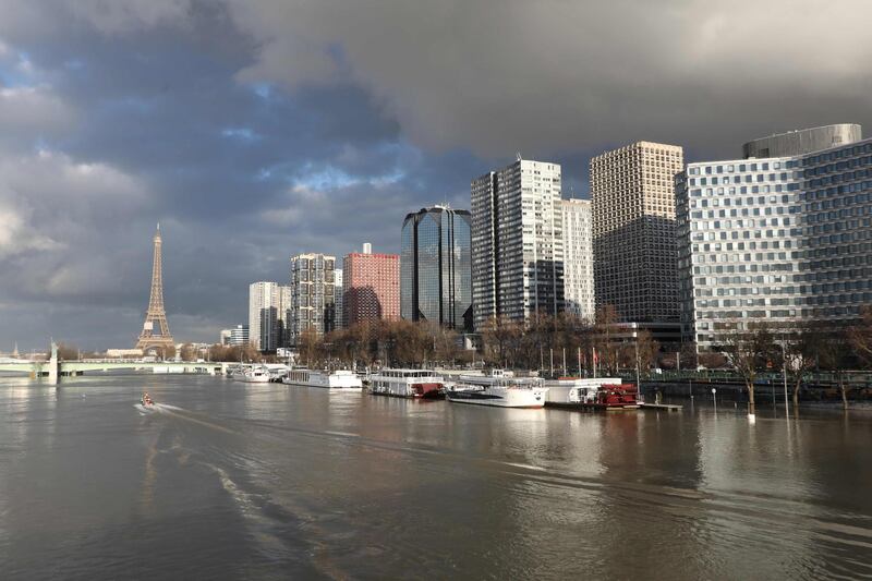 The flooded banks of the river Seine and the Beaugrenelle area and Eiffel Tower in the backround in Paris. Ludovic Marin / AFP