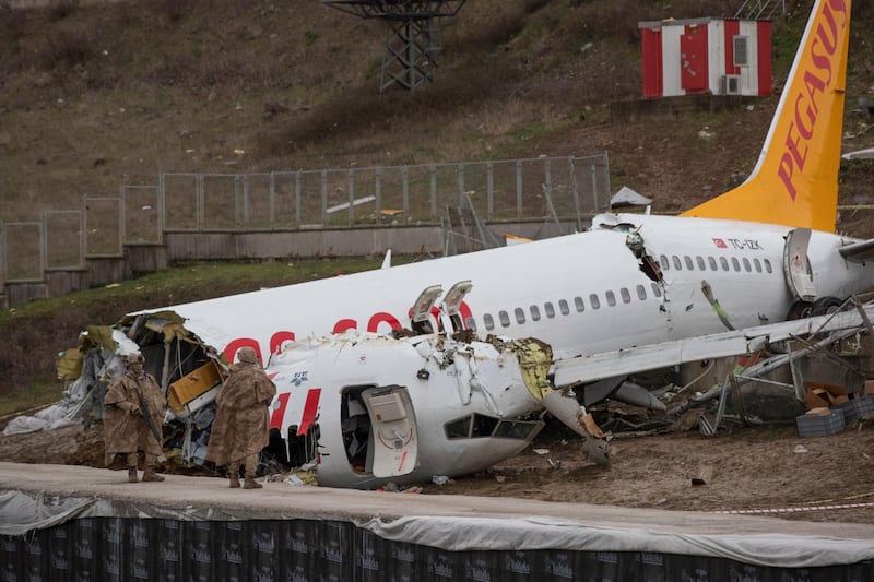 urkish soldiers secure the wreckage after a Pegasus Airlines aircraft skidded off the Sabiha Goekcen airport runway in Istanbul, Turkey.  EPA