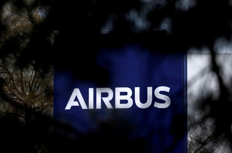 FILE PHOTO: The logo of Airbus is seen at the entrance of a building in Toulouse, France, March 11, 2021. REUTERS/Stephane Mahe/File Photo