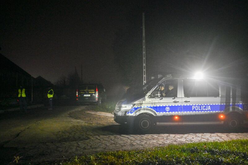 Police vehicles at a checkpoint after a security cordon was set up around the village. Getty 