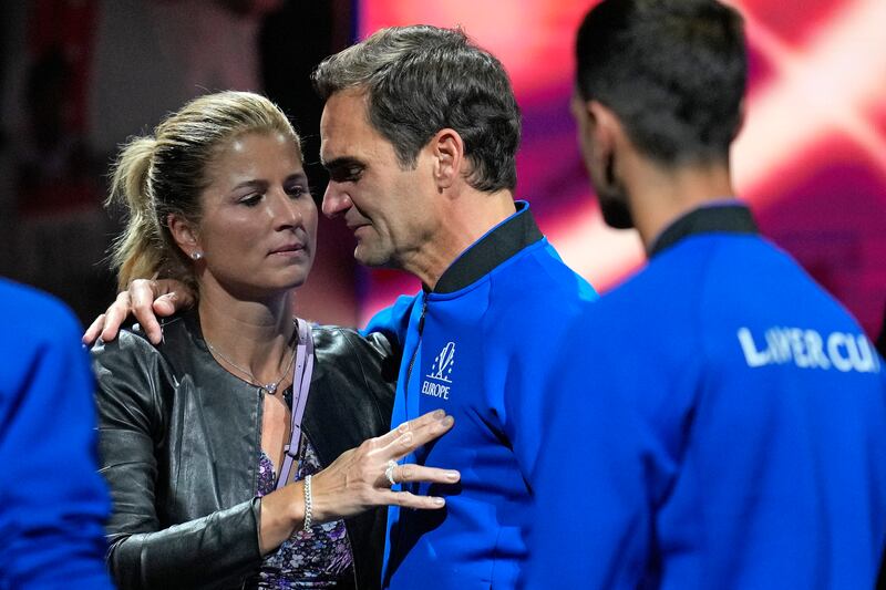 Roger Federer of Team Europe is embraced by his wife Mirka. AP