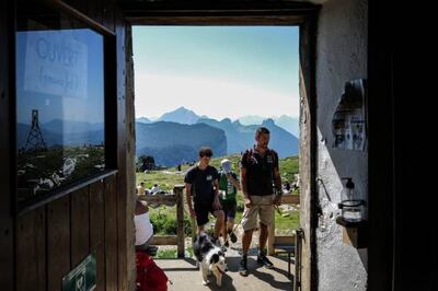 Tourists in Dingy-Saint-Clair, in the French Alps. France is set to drop pre-depature PCR tests for travellers. AFP