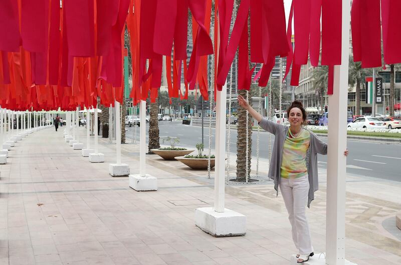 DUBAI , UNITED ARAB EMIRATES , MARCH 1  – 2018 :- Emmanuelle Moureaux , French Artist based in Tokyo with her famous 100 shades of colour art work in Downtown Dubai in Dubai. ( Pawan Singh / The National ) For Arts & Life. Story by Chris