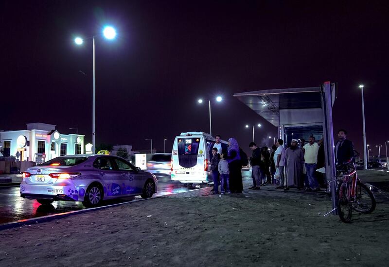 Abu Dhabi, United Arab Emirates, January 9, 2020.  Commuters wait for their bus as it pours at Khalifa City.    
Victor Besa / The National