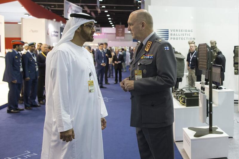 The Crown Prince speaks with Lt General Arto Raty, the deputy prime minister of Finland during his tour of the Finnish stalls. Mohamed Al Hammadi / Crown Prince Court — Abu Dhabi