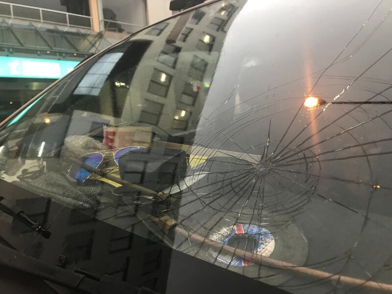 A cracked windshield from hail damage is seen in Sydney, Australia. AAP / Brendan Esposito / via Reuters