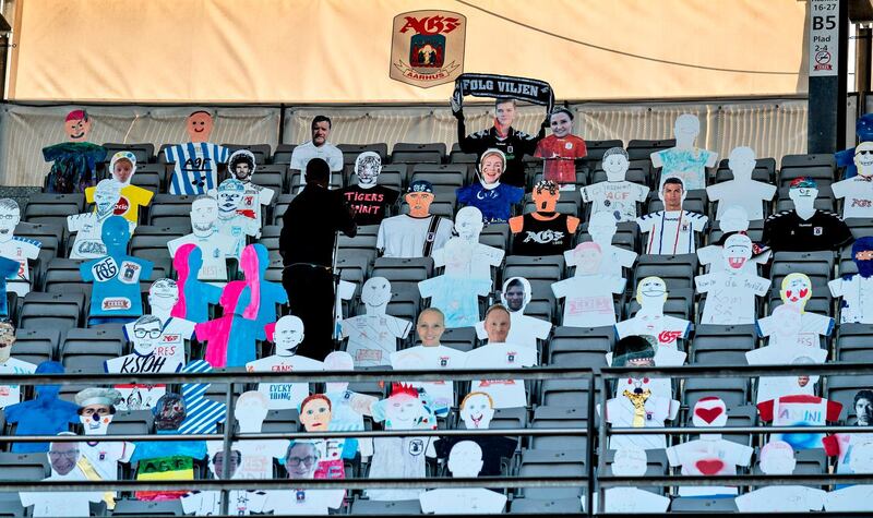 Cardboard cut-out of fans are seen in the stands during the 3F Super League football match between AGF and Randers FC. AFP