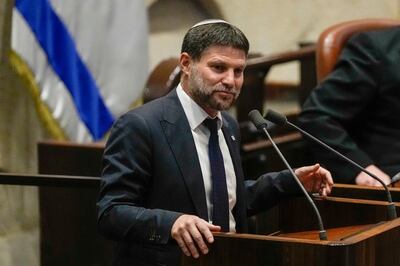 Finance Minister Bezalel Smotrich was approached by family members of hostages outside the Israeli Parliament on Monday. AP