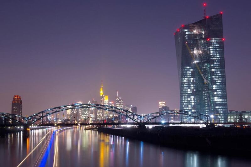 A long exposure of ships passing on the Main river past the new headquarters of European Central Bank in Frankfurt, Germany. Boris Roessler / EPA