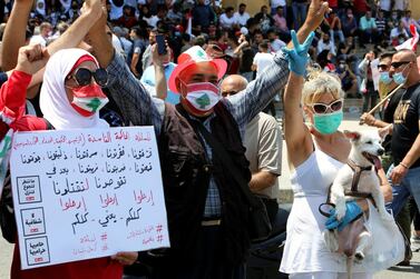 Demonstrators in Beirut demanding removal of the political class, June 6, 2020. The placard reads: "All of you means all of you," Reuters