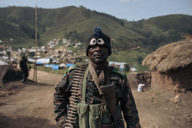 A soldier of the national army poses for a photograph at a military base in Lusogha, Democratic Republic of Congo. AFP