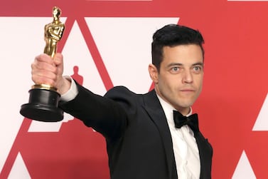 Best Actor Rami Malek poses with his award backstage at the Oscars. Reuters 