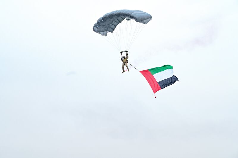A parachutist prepares to land on the parade ground. Photo: Dubai Media Office