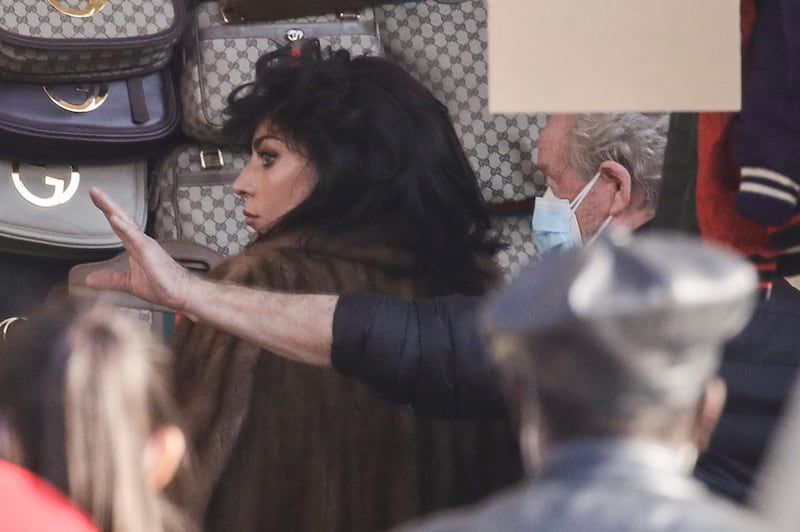 Director Ridley Scott, right, gives instructions to Lady Gaga during the shooting of 'House of Gucci' in Milan, Italy. AP photo