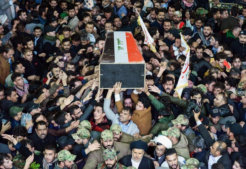 Mourners carry the coffin of slain Iraqi paramilitary chief Abu Mahdi al-Muhandis towards the Imam Ali Shrine in the shrine city of Najaf in central Iraq during a funeral procession. AFP