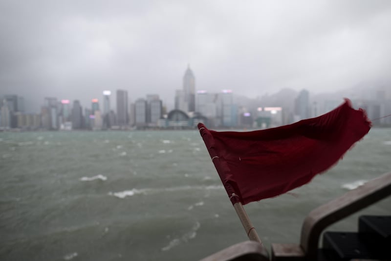 A red flag flies on a pier on the Victoria Harbour waterfront in Hong Kong, China. Jerome Favre / EPA