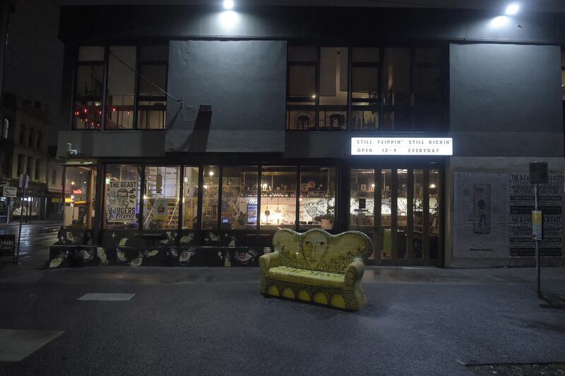 A restaurant offering takeaways remains open during curfew in Fitzroy suburb in Melbourne, Australia. Bloomberg