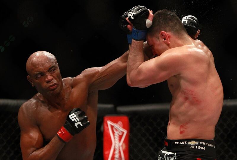 Anderson Silva delivers a punch to Nick Diaz during his unanimous decision victory in the main bout middleweight fight at UFC 183 on Saturday night. Steve Marcus / Getty Images / AFP