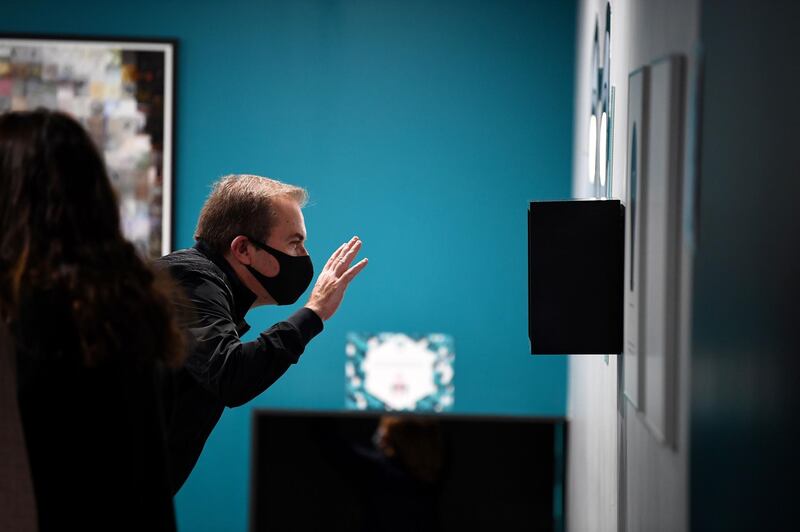 A man a wearing protective mask visits the Museum of Illusion in Paris, as France eased the lockdown measures taken to curb the spread of Covid-19. AFP