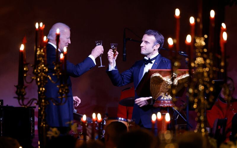 The presidents make a toast. AFP