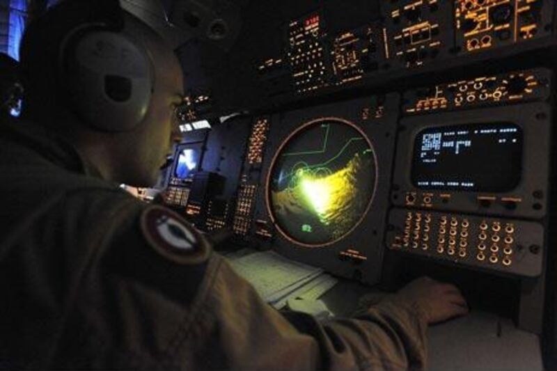Picture released by the ECPAD (The French Defence communication and audiovisual production agency) on June 2, 2009 shows a French military man operating a radar aboard a French reconnaissance Breguet Atlantic II plane flying over the Atlantic ocean off Cape Verde, to search debris of the Air France Airbus flight 447.