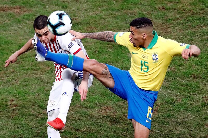 Paraguayan Miguel Almiron, left, vies for the ball with Brazilian Marques Allan. EPA