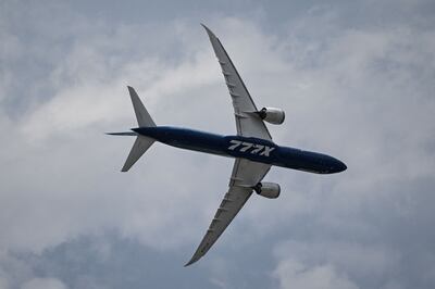 A more conventionally powered Boeing 777X plane takes part in Farnborough Airshow where the package of green measures was announced. AFP