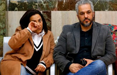 The parents of late Palestinian teenager Nadeem Nuwarah, who was killed during clashes by an Israeli policeman in 2014 in Beitunia in the occupied West Bank, are seen at the district court in Jerusalem on April 25, 2018.
The Israeli court sentenced 24-year-old policeman Deri to nine months in jail for the fatal shooting of the Palestinian teenager in 2014, an incident documented by video footage. 
He was found guilty of negligent homicide and also ordered to pay 50,000 shekels ($14,000) to the family of the then-17-year-old Nuwarah. / AFP PHOTO / AHMAD GHARABLI