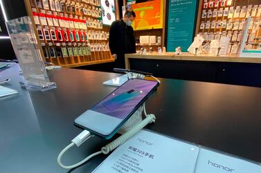 A Honor smartphone model on display for sale at an electronic store in Beijing. Chinese tech giant Huawei is selling its budget-price Honor smartphone brand in an effort to rescue the struggling business from damaging US sanctions imposed on its parent company. AP