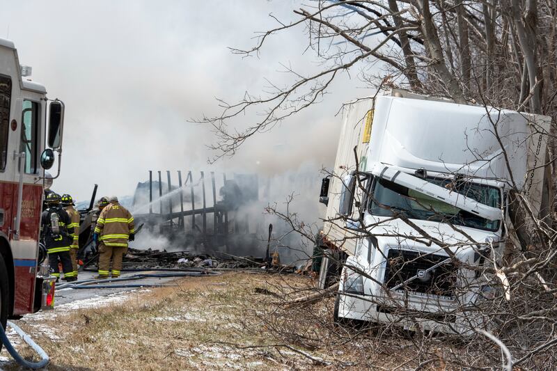 Firefighters work at the scene of the crash. Republican-Herald / AP