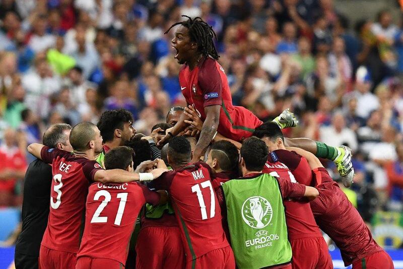 Portugal's players celebrate after they beat France during the Euro 2016 final at the Stade de France in Saint-Denis, north of Paris. Philippe Desmazes / AFP