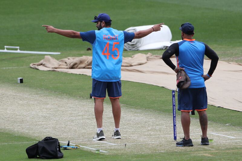 Rohit Sharma inspects the pitch during a practice session. AFP