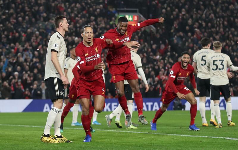 Soccer Football - Premier League - Liverpool v Manchester United - Anfield, Liverpool, Britain - January 19, 2020   Liverpool's Virgil van Dijk celebrates scoring their first goal with Georginio Wijnaldum   Action Images via Reuters/Carl Recine    EDITORIAL USE ONLY. No use with unauthorized audio, video, data, fixture lists, club/league logos or "live" services. Online in-match use limited to 75 images, no video emulation. No use in betting, games or single club/league/player publications.  Please contact your account representative for further details.