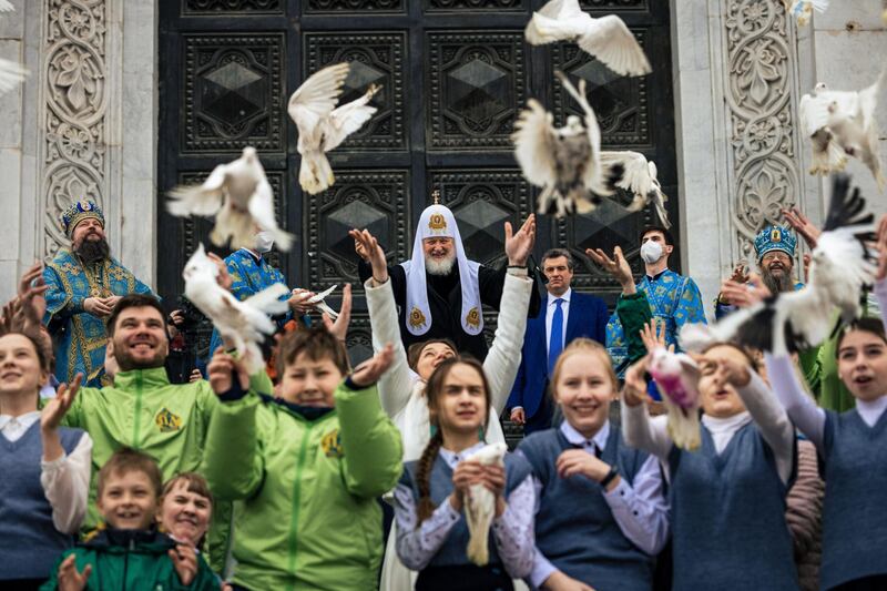 Russian Orthodox Patriarch Kirill and Orthodox believers release white doves after a Mass to mark the Holiday of Annunciation in front of the Cathedral of Christ the Saviour in Moscow. Annunciation celebrates the revelation to the Virgin Mary that she would bear a son, Jesus. AFP