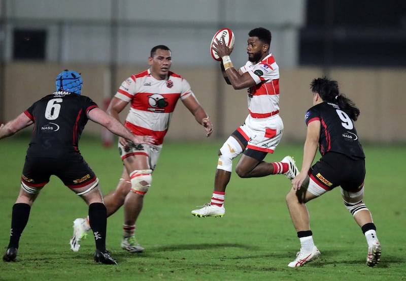 Tigers' Niko Volavola gathers the ball under pressure from Bahrain. 