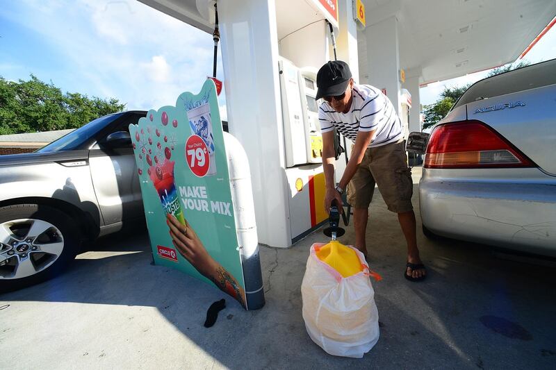 Van Nguyen fills a gas can in Winter Springs. AFP