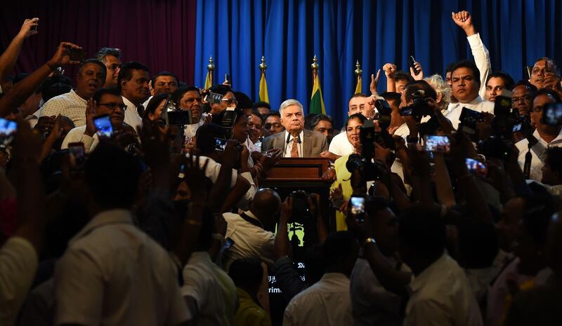 Sri Lanka's Prime Minister Ranil Wickremesinghe speaks to supporters at his official residence in Colombo. AFP