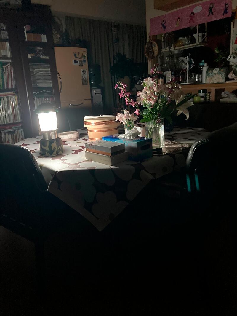 A lamp is used during an outage following an earthquake in Ichikawa, Chiba prefecture, about 230 kilometers (143 miles) away from Fukushima Saturday, Feb. 13, 2021. AP