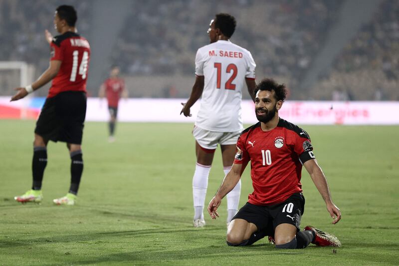 Egypt's Mohamed Salah celebrates next to Sudan's Mustafa Ahmed Saeed Elfadni after the final whistle as Egyppt advanced to the last 16 at Afcon 2021. AFP