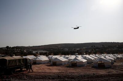 A Greek army's helicopter carrying European Council President Charles Michel flies over the temporary camp where refugees and migrants from the destroyed Moria camp will be accommodated, on the island of Lesbos, Greece, September 15, 2020. Dimitris Tosidis/Pool via REUTERS