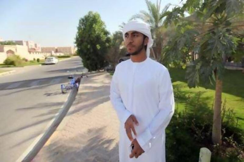 Abdul Aziz, 20, a resident of Mohammed Bin Zayed City in Abu Dhabi complains about a lack of amenities. (Sammy Dallal / The National)
