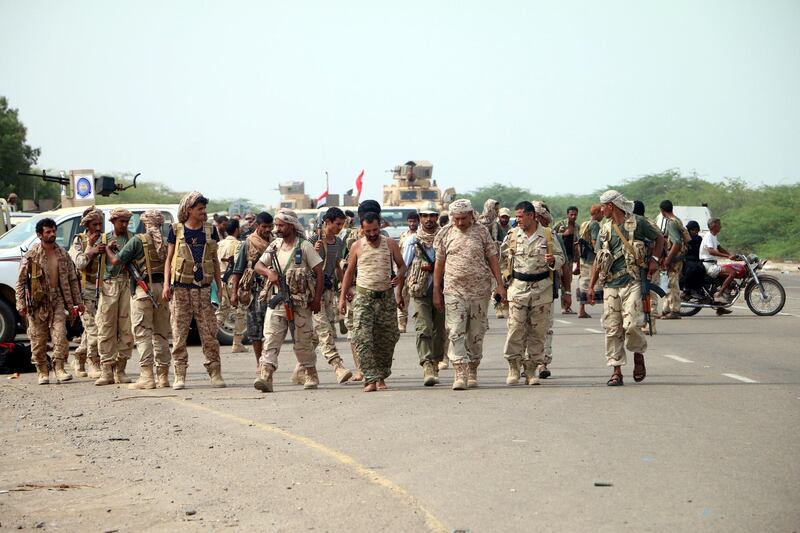 epa06803026 Yemeni forces backed by the Saudi-led coalition gather near the outskirts of the western port city of Hodeidah, Yemen, 12 June 2018. According to reports, the Saudi-led military coalition and Yemeni government forces continue to send reinforcements toward the port city of Hodeidah, preparing to launch an assault on the Houthis-controlled main port of Yemen.  EPA/NAJEEB ALMAHBOOBI