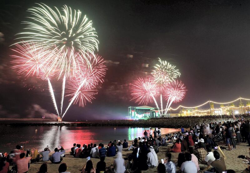 Dubai, United Arab Emirates - December 01, 2019: Fireworks go off at La Mer for the 48th UAE national day. Sunday, December 1st, 2019. La Mer, Dubai. Chris Whiteoak / The National