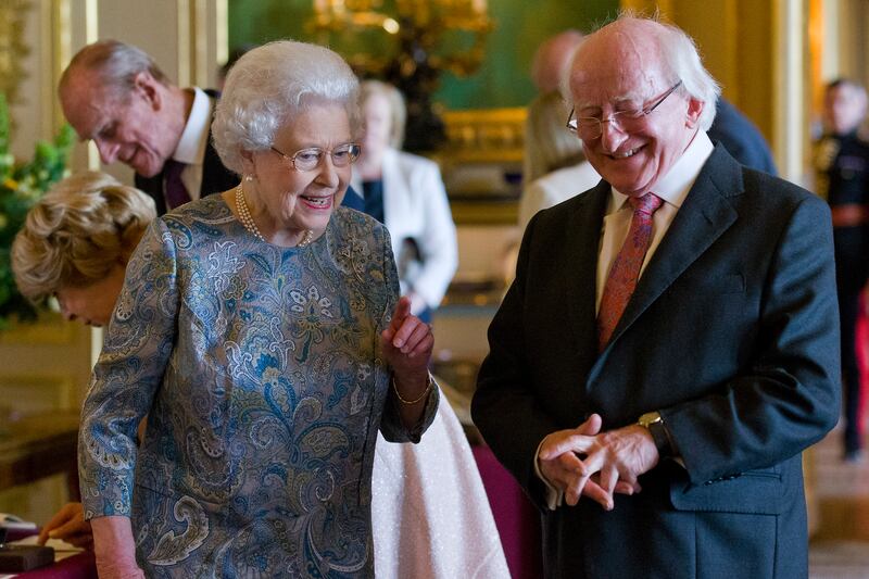 Queen Elizabeth shows Irish President Michael D Higgins Irish related items from the Royal Collection at Windsor Castle in April 2014. It was the first official visit by an Irish head of state to the UK. Getty Images