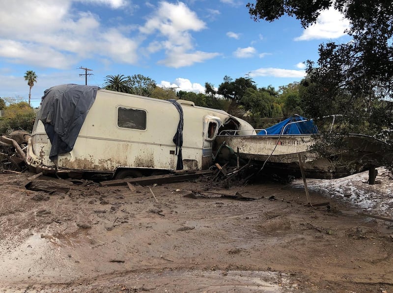 Damaged vehicles that were pushed by mudflow and onto the US 101 Freeway from nearby residential area following heavy rains in Montecito, California. Mike Eliason / Santa Barbara County Fire / EPA