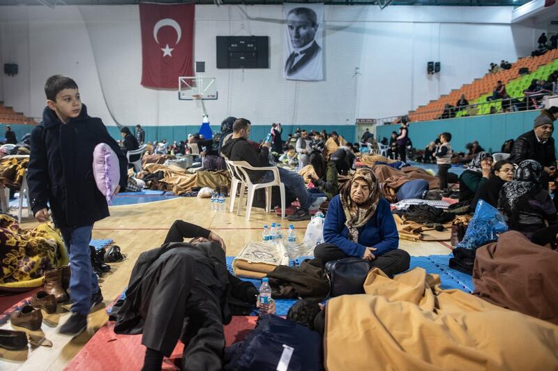 Earthquake survivors spend the night in a sports hall in Elazig, Turkey. Getty Images