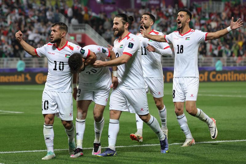 There were emotional scenes as Palestine's players celebrated their second goal at the Abdullah bin Khalifa Stadium in Doha. AFP 