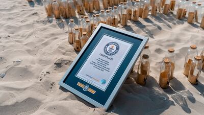 More than 1,100 bottles with messages in them were lined up on Saadiyat Beach. Photo: Saadiyat Island